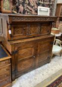 A Charles II oak court cupboard, dated 1673, width 140cm, depth 52cm, height 148cm