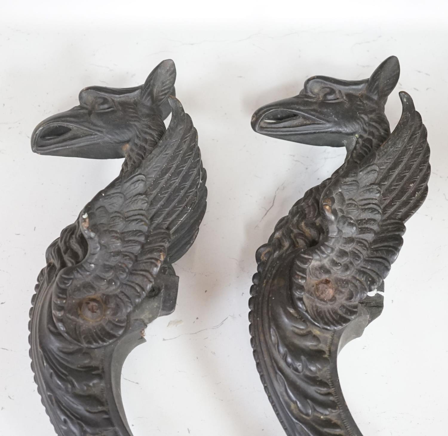 A pair of 19th century bronze griffin furniture mounts 62cm