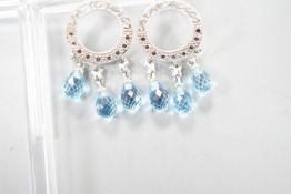 A pair of 14k white metal, diamond chip and three stone facetted blue topaz set drop earrings, 31mm,