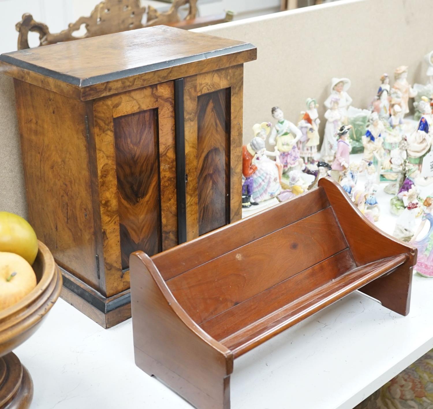 A Victorian walnut collector’s cabinet of drawers and adjustable book trough made out of ‘mahogany