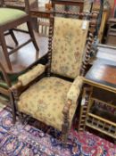 A Victorian spiral turned upholstered open armchair, width 60cm, depth 58cm, height 117cm