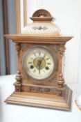 A German Black Forest mantel clock with pendulum 34.5cm