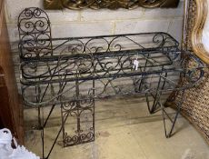 A pair of metal wrought iron pot stands, width 107cm, height 62cm together with two wrought iron