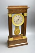 A French rosewood and marquetry portico clock, with pendulum, no key, 44 cms high.