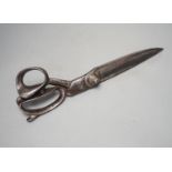 A pair of over-sized tailor’s scissors, one blade stamped ‘1938 \ 5110.99.910.5934’