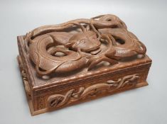 A Burmese carved wood 'Dragon' box, 31cm wide