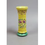 A 19th century Chinese (Qing) yellow background vase,15 cms high.