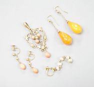 A gold and coral mounted pendant and coral earrings and a pair of amber and gold earrings