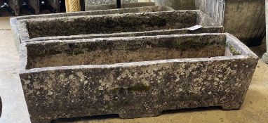 Three rectangular reconstituted stone garden planters, one lacking base, largest width 91cm,