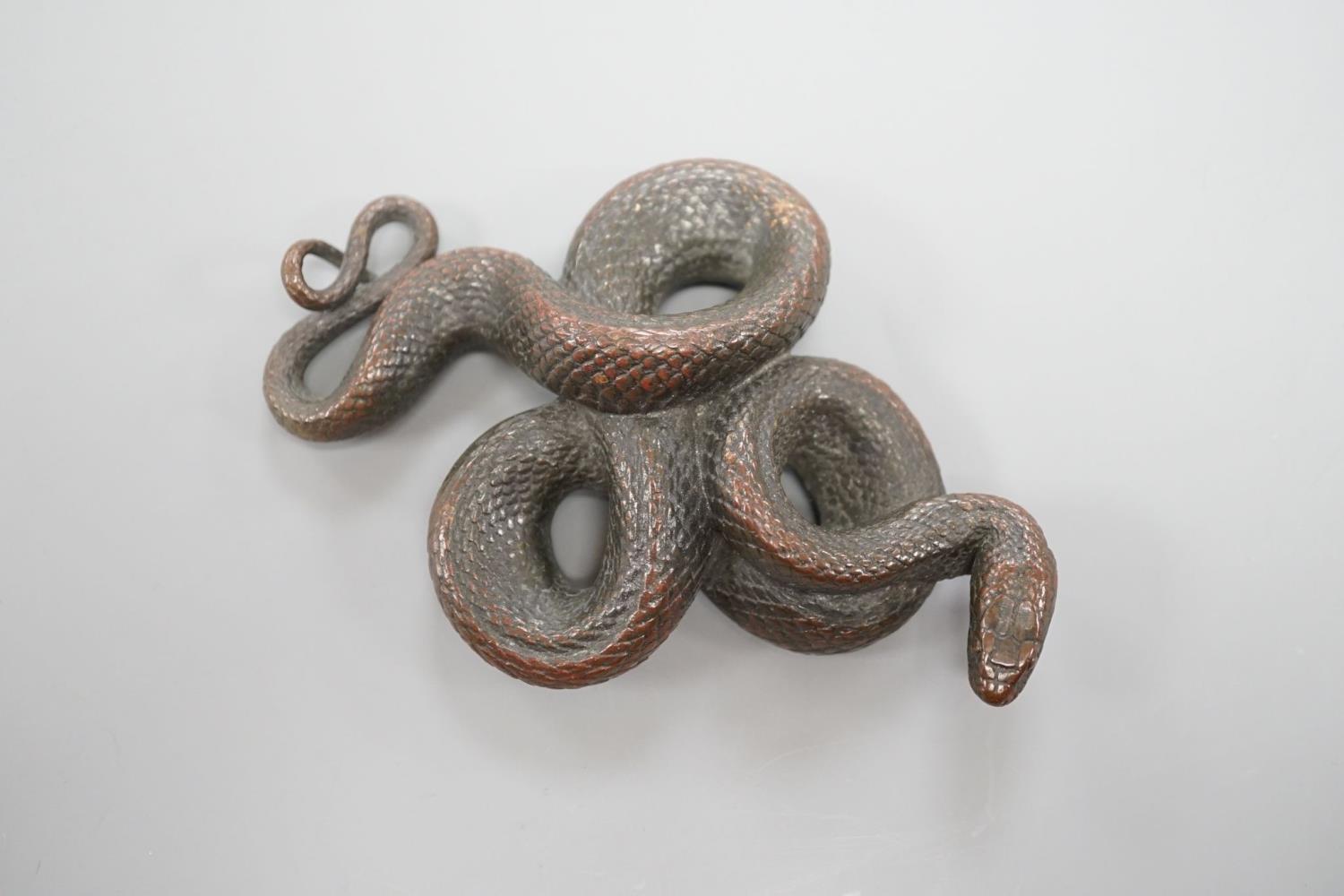 A European cast bronze figure of a snake,12 cms wide.