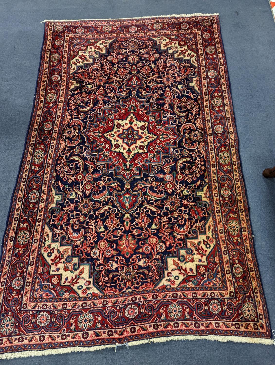A North West Persian blue ground rug, 210 x 130cm