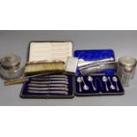 Four assorted silver mounted glass toilet jars, a silver mounted brush, two combs and a shoe horn