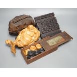 A Chinese carved wood frog, 22cm long, a carved Buddha, woodblock and a part-set of draughtsmen