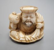 A Japanese ivory netsuke of Daikoku, Meiji period,3 cms high.