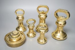 A set of 5 Victorian graduated cast brass bell weights and 3 graduated cast brass disc weights (8)