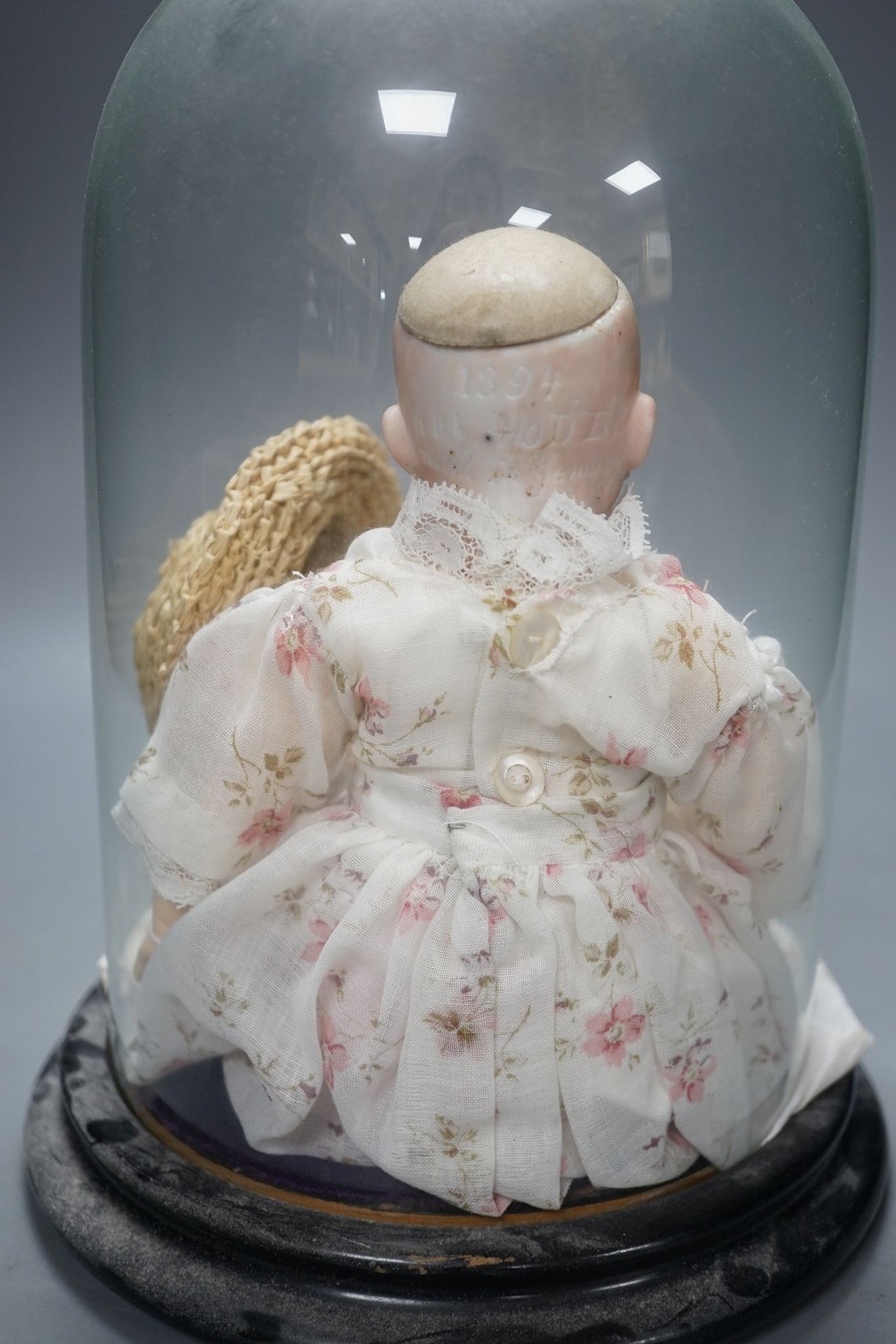 An Armand Marseille bisque doll, mould 1894, under glass dome 29cm - Image 3 of 4