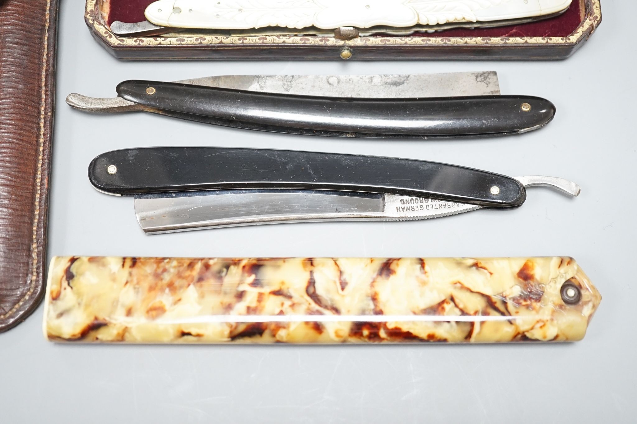 A leather cased pair of mother-of-pearl handled cut throat razors, by J Crawford and three other - Image 5 of 5