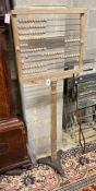 A Brown's decimal ball frame abacus, height 115cm