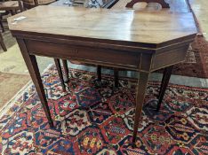 A George III faded mahogany folding tea table, width 97cm, depth 47cm, height 75cm