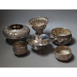 Six assorted embossed white metal bowls, including Indian and Thai, tallest 13.6cm.