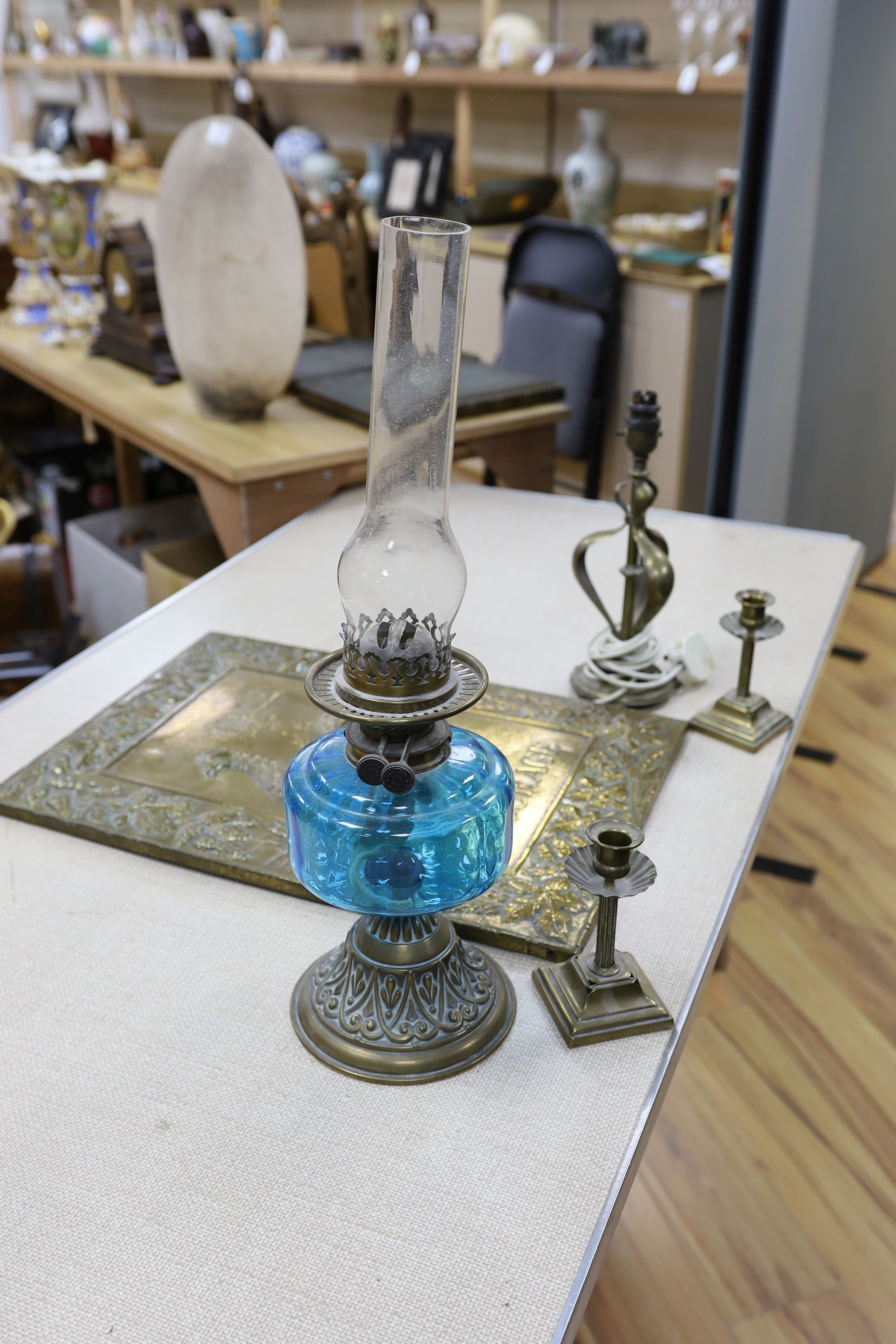 A brass Art Nouveau lamp, a pair of candlesticks, oil lamp and brass Courage advertising sign - Image 2 of 4