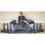 A large Art Deco style marble and spelter figural mantel ornament,74 cms wide.