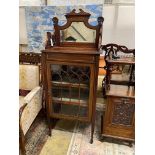 An Edwardian satinwood banded mahogany mirrored back music cabinet, width 56cm, depth 36cm, height