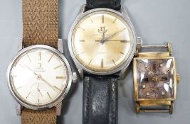 A gentleman's stainless steel Omega Seamaster manual wind wrist watch and two other watches.