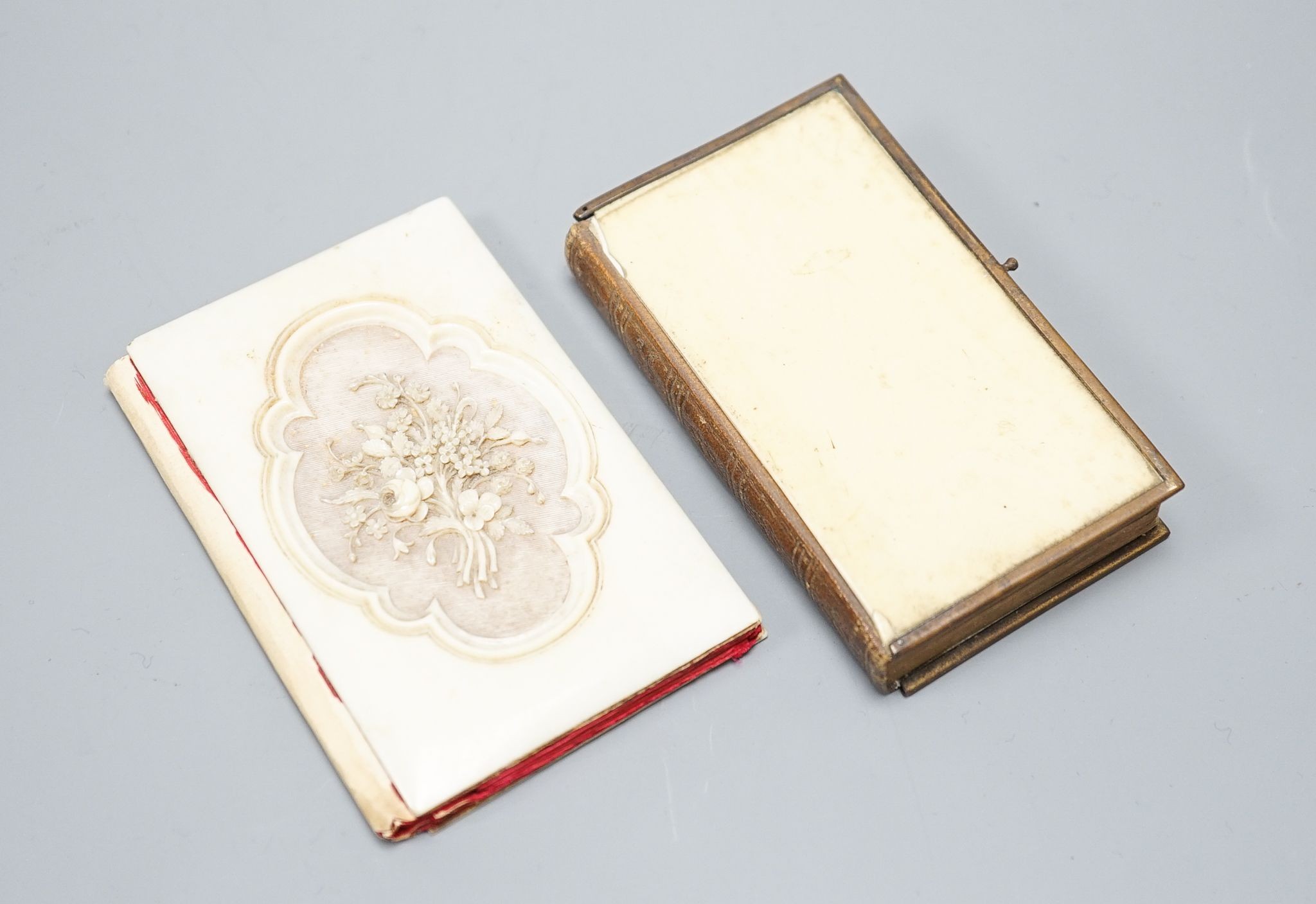 A carved ivory card case and an ivory-bound church missal,Card case 10 cms high.