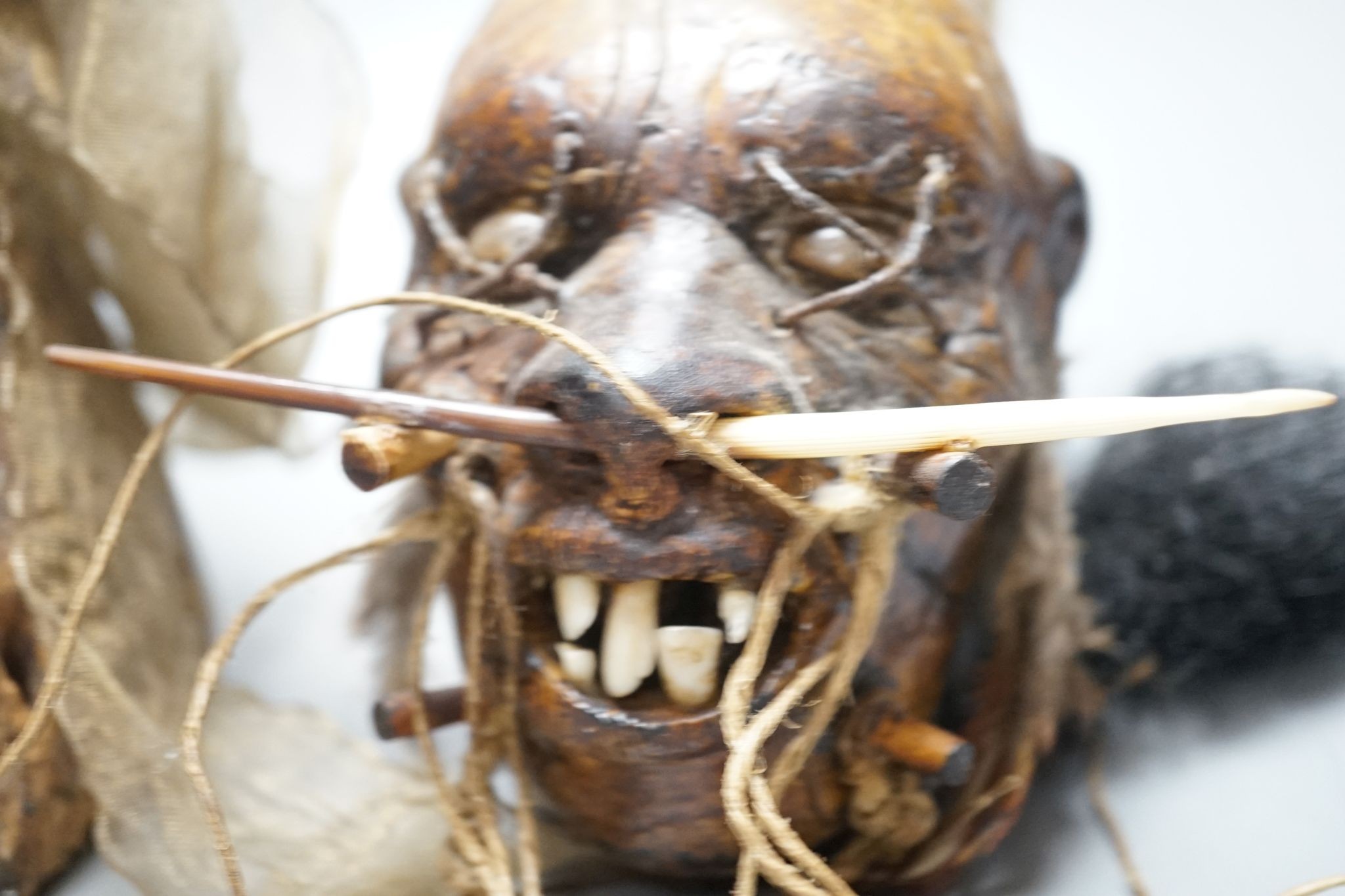 An African tribal carving, 31cm and a pottery model of a shrunken head - Image 5 of 6