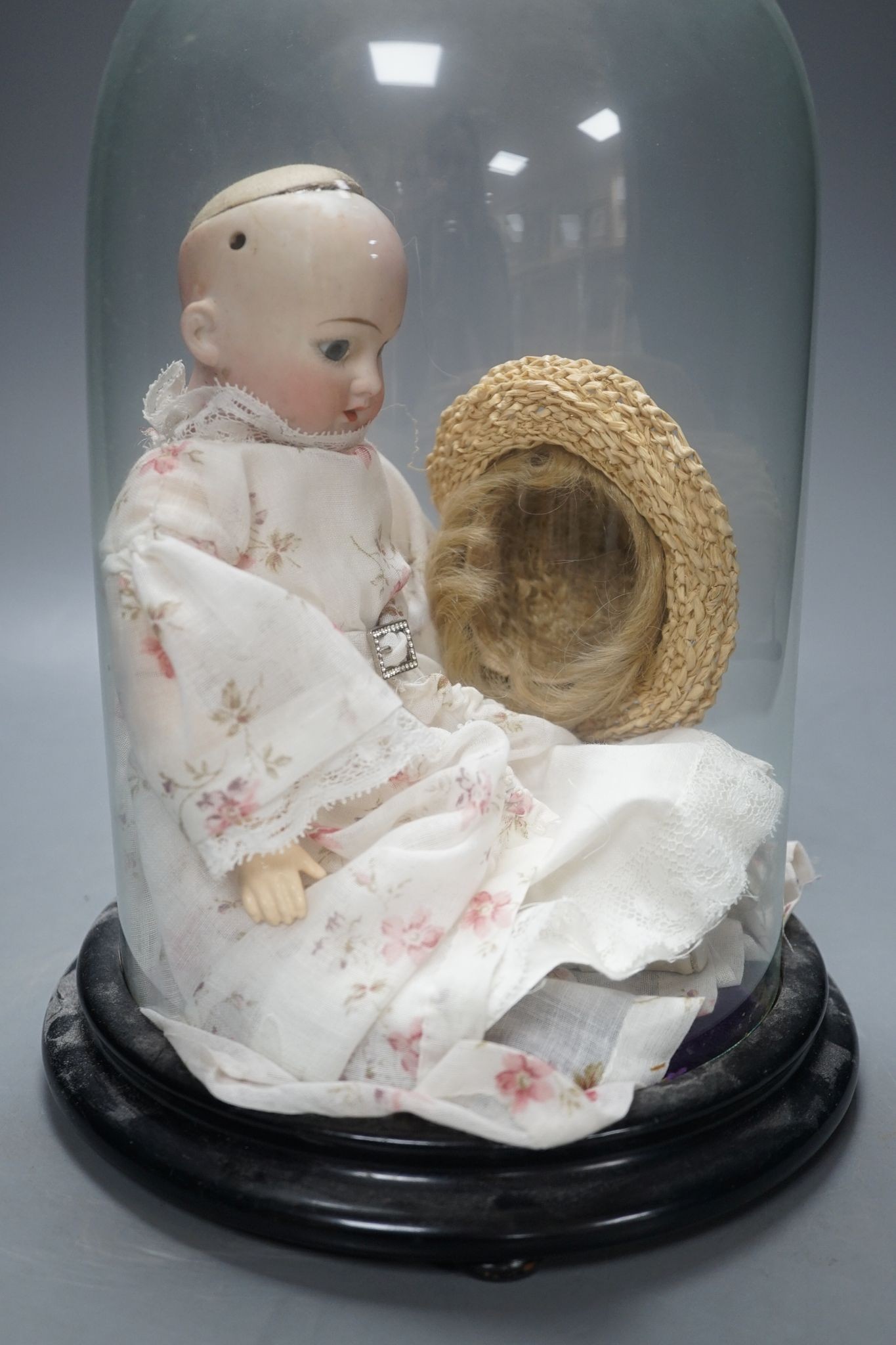 An Armand Marseille bisque doll, mould 1894, under glass dome 29cm - Image 2 of 4