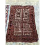 An Afghan red ground prayer rug, 166 x 120cm