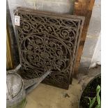 Three Victorian style rectangular cast iron panels, largest width 64cm, height 41cm