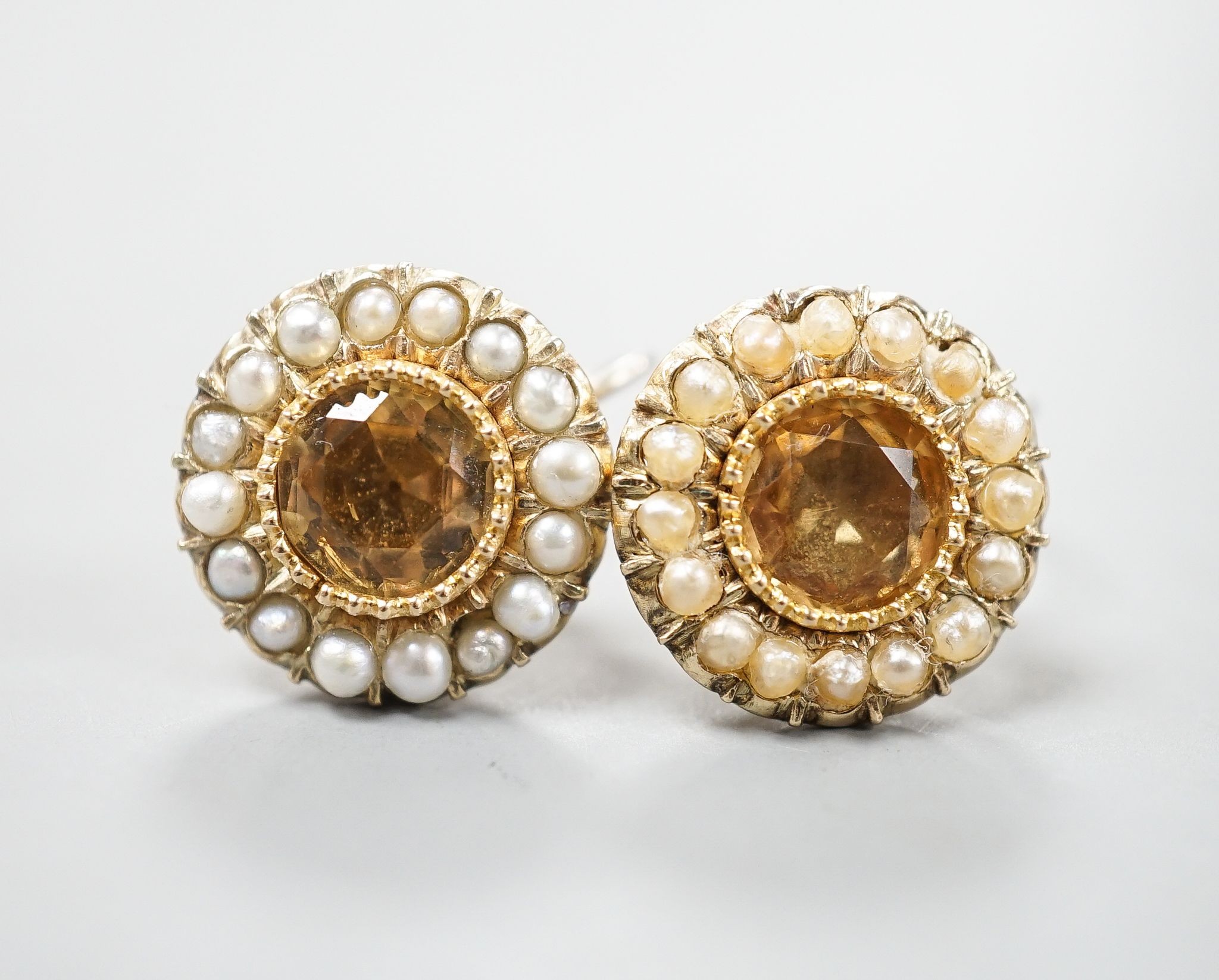 A pair of yellow metal, yellow topaz and split pearl set ear clips(adapted?), 14mm, gross 5.8