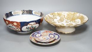 A Royal Crown Derby Imari bowl and two plates and another bowl, 25cm