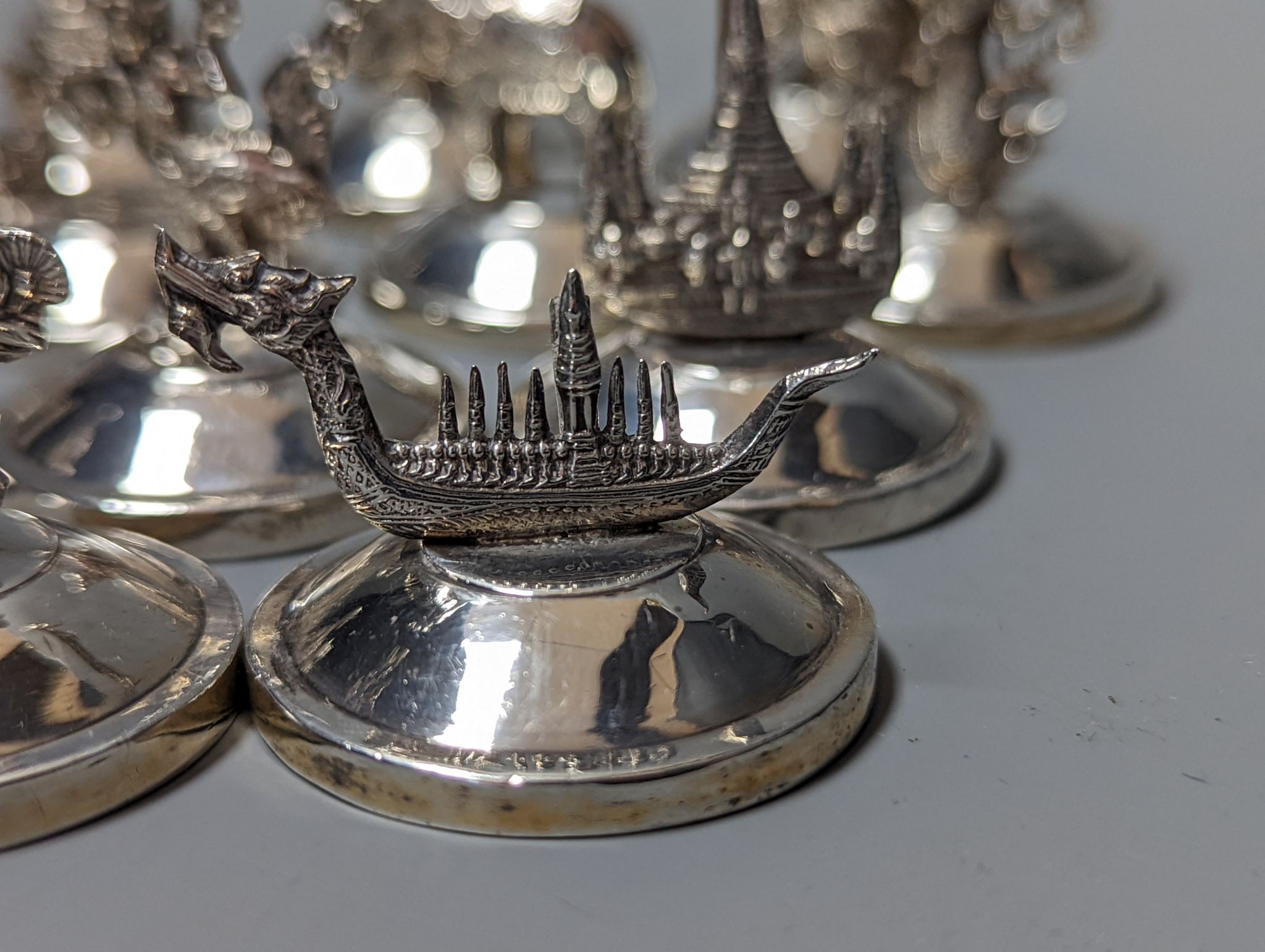 Sixteen assorted Siamese sterling mounted menu holders, modelled with figures, elephant, etc. - Image 4 of 17