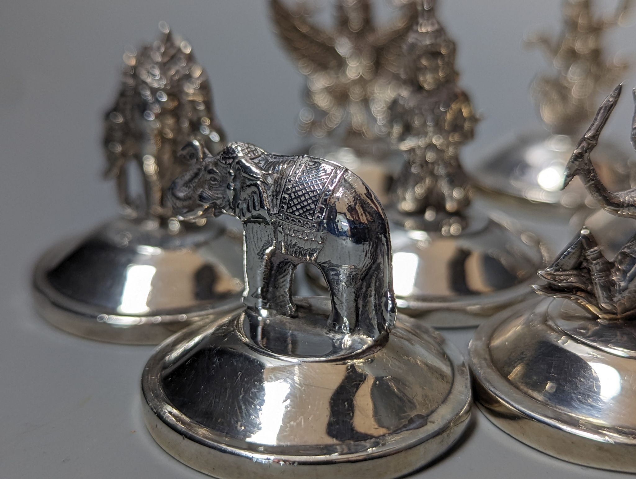 Sixteen assorted Siamese sterling mounted menu holders, modelled with figures, elephant, etc. - Image 8 of 17