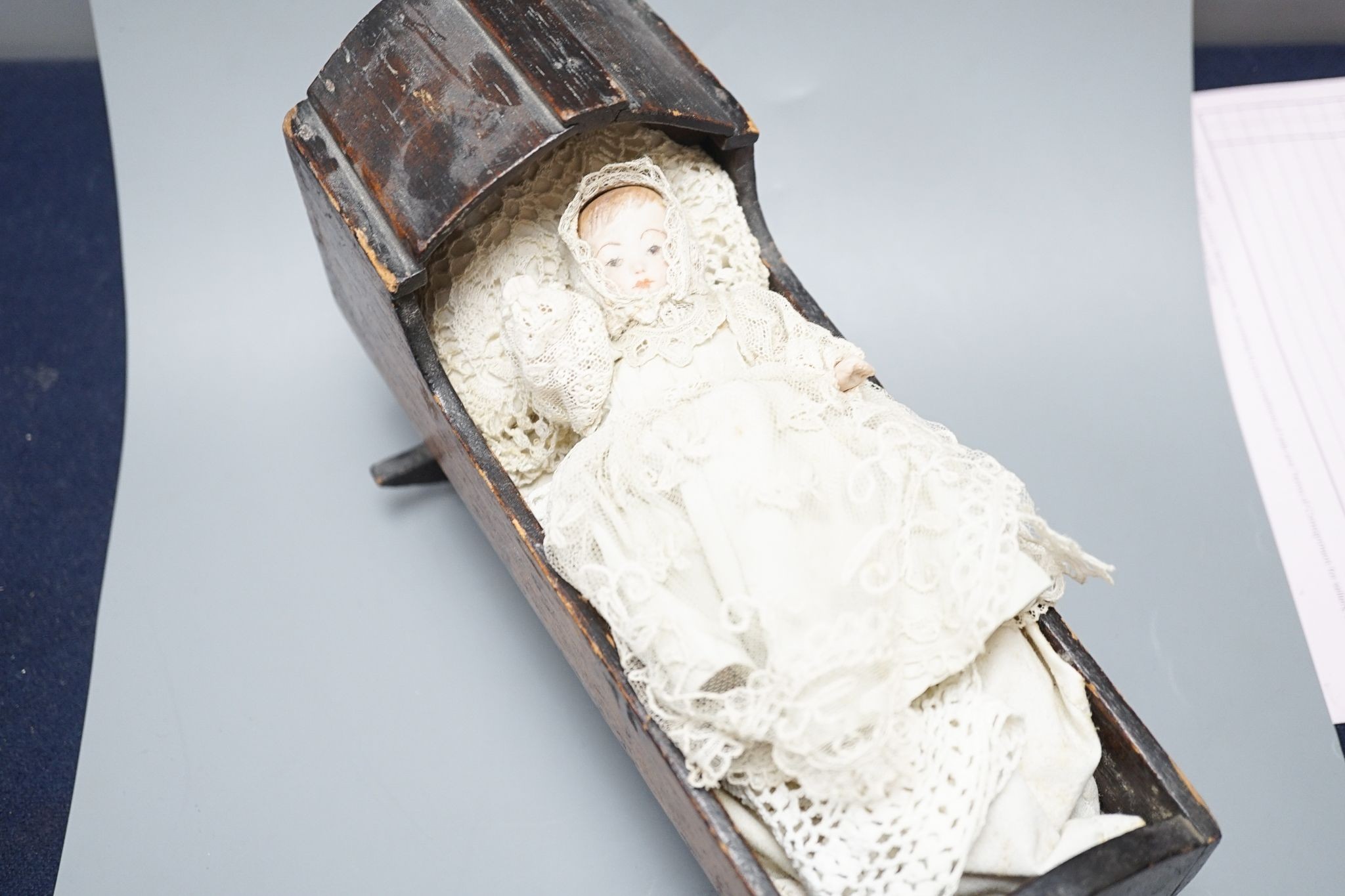 A collection of miniature bisque dolls and another larger doll in a wooden cradle, 11 dolls in - Image 2 of 8