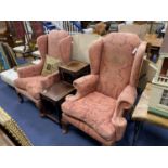 A pair of George I style upholstered wing armchairs on acanthus carved oak feet, width 82cm, depth