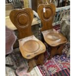 A pair of 18th century style Italian oak hall chairs, width 38cm, depth 50cm, height 91cm