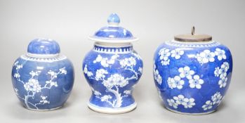 Three Chinese blue and white prunus decorated jars and covers, 19th/20th century, with four