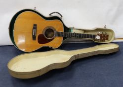 A Yamaha FG-700 acoustic guitar in hard case