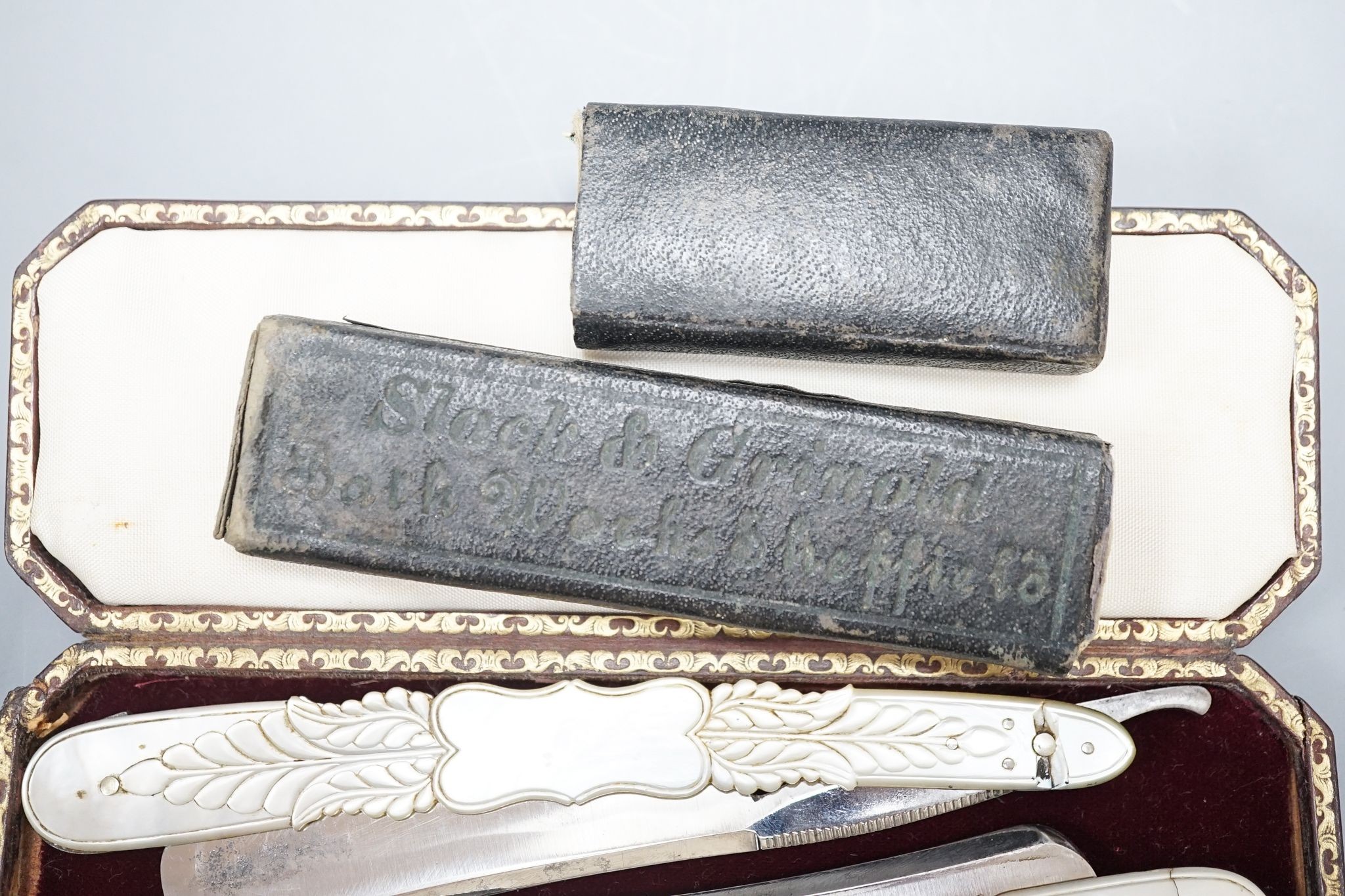 A leather cased pair of mother-of-pearl handled cut throat razors, by J Crawford and three other - Image 2 of 5