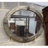 An Art Nouveau style oval metal framed wall mirror, width 70cm, height 54cm
