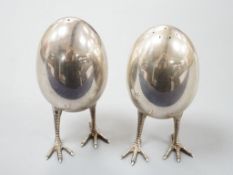 A pair of modern silver eggs on legs pepper and salt condiments, Francis Howard Ltd, London, 2015,