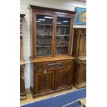 A late Victorian carved walnut secretaire bookcase, length 122cm, depth 48cm, height 226cm