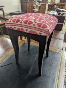 A square ebonised footstool upholstered in Andrew Martin fabric, width 32cm, height 50cm