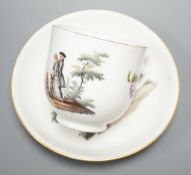 A 19th century Meissen porcelain tea cup and saucer decorated with 18th century figures