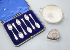 A set of six silver teaspoons, a silver two handled small butter dish, with glass liner and silver