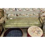 A weathered teak garden bench, length 150cm, depth 54cm, height 78cm